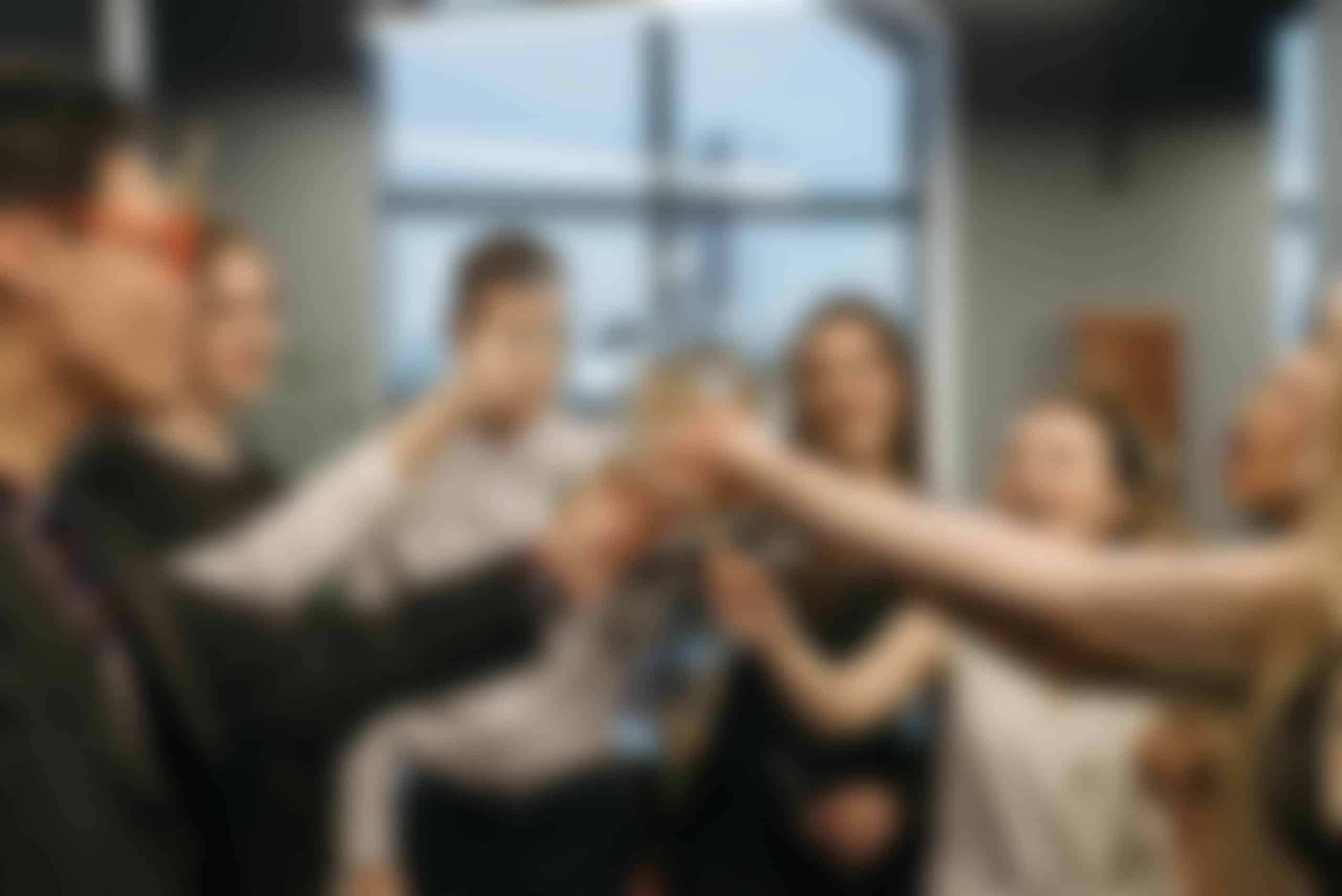 A diverse group of friends enjoying a fun and lively gathering, taking photos together