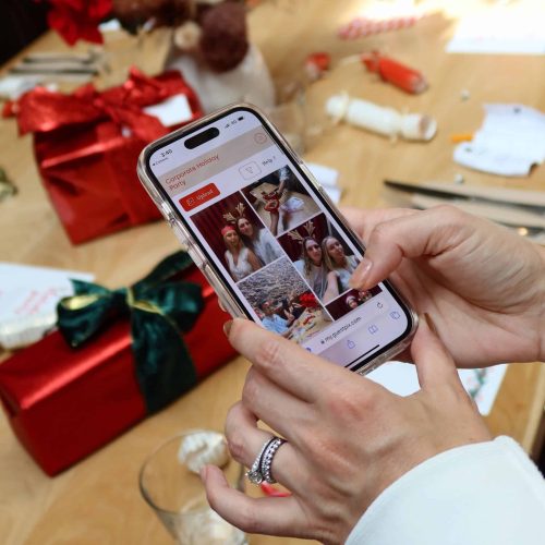 Uploads festive holiday photos to GUESTPIX event platform for holiday party.