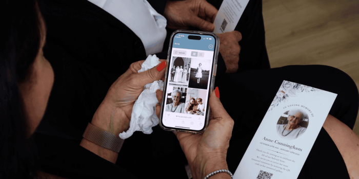 QR code event photo sharing on mobile device at memorial service, capturing personal memories using GUESTPIX platform.
