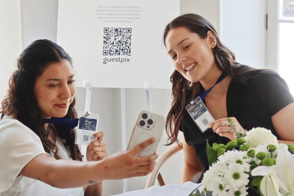 Conference Guests taking photos with their QR Code Lanyards - GUESTPIX Business Banner
