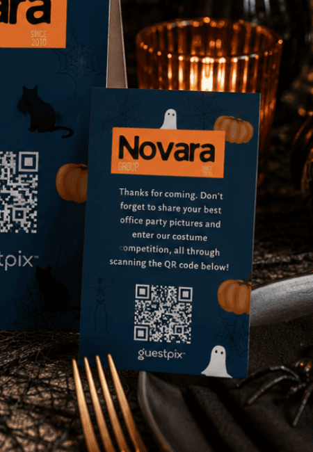 Blue event card with 'Novara Group' logo, pumpkins, ghosts, and a QR code for photo contest; Halloween-themed.