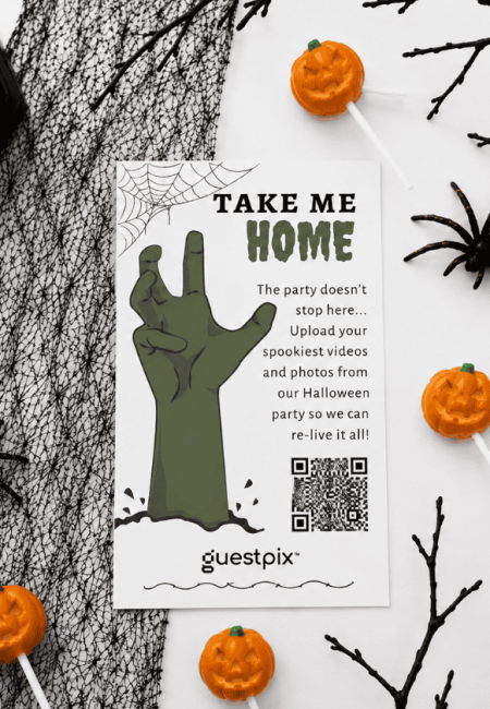 Halloween invitation flyer featuring a green zombie hand, spider web, pumpkins, and a QR code with the headline 'TAKE ME HOME'.
