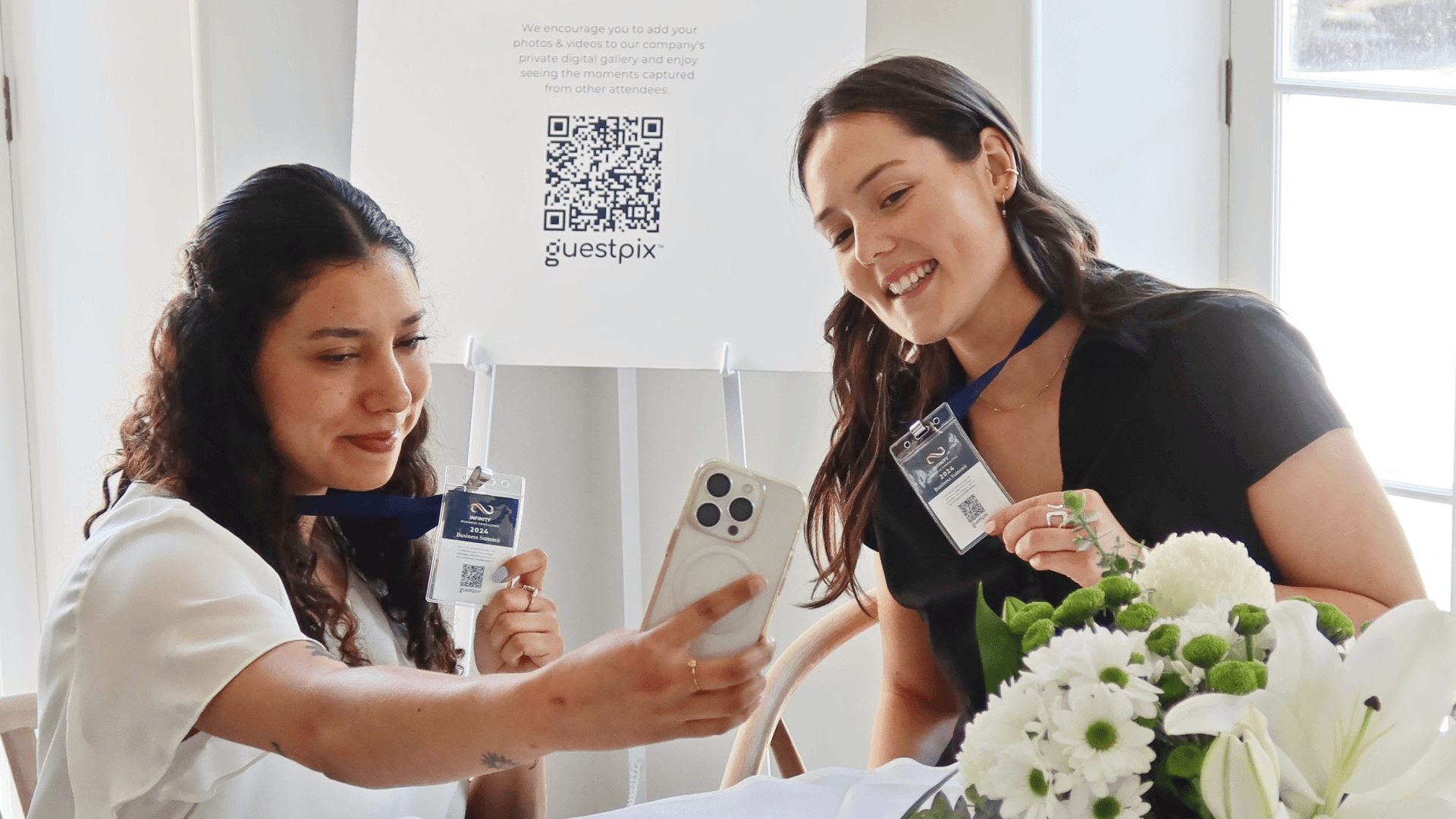 Conference Guests taking photos with their QR Code Lanyards - GUESTPIX Business Banner